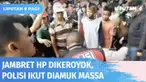 Jambret telepon genggam di Kawasan Cakung diamuk warga. Setelah dibawa ke mobil polisi, warga yang masih emosi berusaha merusak dan membakar sepeda motor pelaku. Emosi tak kunjung redam, polisi jadi sasaran amuk warga.
