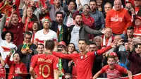 Pemain Timnas Portugal, Cristiano Ronaldo, merayakan gol ke gawang Timnas Swiss dalam semifinal UEFA Nations League di Estadio do Dragao, Porto, Kamis dini hari WIB (6/6/2019). Portugal menang 3-1. (AFP/Miguel Riopa).