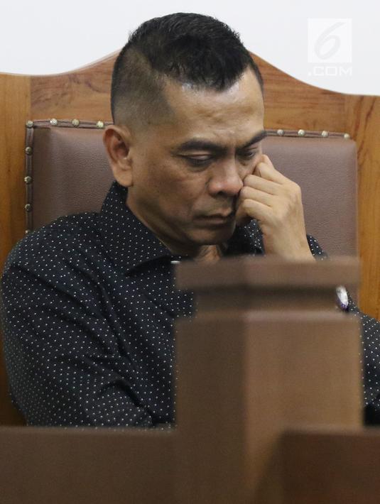 Mantan anggota DPRD DKI Jakarta, Mohamad Sanusi saat menjalani sidang lanjutan Peninjauan Kembali (PK) di PN Jakarta Pusat, Rabu (25/7/2018). M Sanusi merupakan terpidana suap pembahasan Raperda tentang Reklamasi. (Liputan6.com/Helmi Fithriansyah)