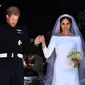 Pangeran Harry dan Meghan Markle saat resmi mengikat janji suci pernikahan. (Ben STANSALL / AFP)