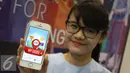 Penjaga stan menunjukan aplikasi My Hong Kong Guide bagi wisatawan yang akan ke Hong Kong di Travel Fair, Jakarta, Jumat (28/8/2015). Naiknya nilai tukar Dollar AS terhadap Rupiah berdampak terhadap pelaku jasa pariwisata. (Liputan6.com/Gempur M Surya)