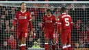 Bek Liverpool Joel Matip (tengah) tertenduk lesu setelah melakukan gol bunuh diri saat bertanding melawan West Bromwich Albion pada putaran keempat Piala FA di stadion Anfield, Inggris (27/1). Liverpool takluk 3-2. (Peter Byrne / PA via AP)