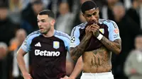 Striker Aston Villa asal Inggris #09, Marcus Rashford (kanan), dan gelandang Aston Villa asal Skotlandia #07, John McGinn, bereaksi selama pertandingan leg kedua perempat final Liga Champions UEFA antara Aston Villa dan Paris Saint-Germain di Villa Park di Birmingham, Inggris bagian tengah, Rabu dini hari WIB (16-4-2025). (Paul ELLIS /AFP)