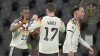 Florian Wirtz (tengah) dkk. merayakan gol Jerman ke gawang Slovakia di Grup A Kualifikasi Piala Dunia 2026 zona Eropa di Leipzig, Selasa (18/11/2025) dini hari WIB.&nbsp;(AP Photo/Matthias Schrader)