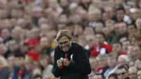 Ekspresi bahagia Jurgen Klopp menyaksikan kemenangan 4-1 Liverpool atas Leicester City di Anfield, Minggu (11/9/2016) dinihari WIB. (Reuters)