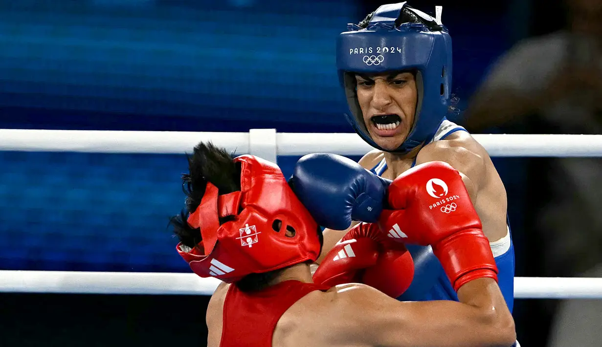Kepastian itu didapat usai Imane Khelif menang angka mutlak atas petinju wanita Thailand Janjaem Suwannapheng. (Mauro PIMENTEL / AFP)