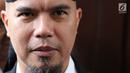 Ekspresi terdakwa perkara ujaran kebencian, Ahmad Dhani saat menghadiri sidang lanjutan di PN Jakarta Selatan, Senin (14/5). Eksepsi Ahmad Dhani ditolak karena materinya dinilai terkait dengan materi pokok perkara. (Liputan6.com/Immanuel Antonius)