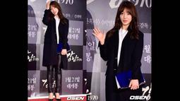Mengenakan coat panjang berwarna hitam dengan skinny pants berwarna senada, Park Shin Hye menghadiri premier film Lee Min Ho, Gangnam Blues di Seoul Megabox, Selasa   (20/1/2015) malam.(dramafever.com)
