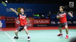 Pebulu tangkis ganda putra Indonesia, Marcus Fernaldi Gideon/Kevin Sanjaya Sukamuljo saat melawan Satwiksairaj Rankireddy/Chirag Shetty (India) di babak 16 besar Indonesia Open 2019 di Istora Senayan, Jakarta, Kamis (18/7/2019). Marcus/Kevin unggul 21-15, 21-14. (Liputan6.com/Helmi Fithriansyah)