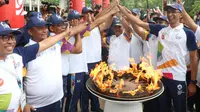 Jajaran Komisaris, Direksi dan para petinggi Bank BNI berpartisipasi meramaikan Kirab Obor Asian Games 2018 di kota Banda Aceh.  (BNI)