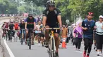 Sejumlah warga berolahraga saat Hari Bebas Kendaraan Bermotor (HBKB) di Bundaran Hotel Indonesia (HI), Jakarta, Minggu (29/12/2024). (Liputan6.com/Herman Zakharia)