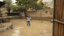 Wesam AL Shawa berjalan di atas air saat memeriksa halaman rumah keluarganya yang terendam banjir saat hujan deras di kamp pengungsi Shati, di Kota Gaza, Selasa (8/11/2022). Hujan deras menyebabkan banjir bandang di Jalur Gaza pada hari Selasa, di mana infrastruktur yang bobrok sering membuat air banjir tidak surut, memperpanjang kerusakan. (AP Photo/Adel Hana)