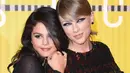 Tak hanya itu, Selena Gomez pun hadir sebagai surprise guest di konser Taylor Swift. (MARK RALSTON / AFP)