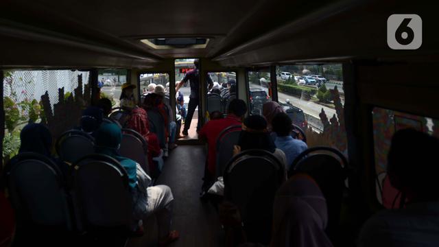 FOTO: Wisata Keliling Ibu Kota Naik Bus Tingkat Transjakarta