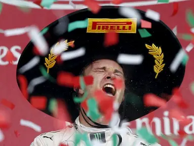 Ekspresi Nico Rosberg setelah menjuarai F1 GP Meksiko di Sirkuit Autodromo Hermanos Rodriguez, Senin (2/11/2015) dini hari WIB. (Reuters/Edgard Garrido)