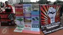 Sejumlah aktivis melakukan aksi bertajuk "Reklamasi Teluk Benoa Bali Harga Mati" saat Car Free Day, Jakarta, Minggu (20/3/2016). Mereka mendukung revitalisasi karena memberi banyak keuntungan kepada warga Bali. (Liputan6.com/Johan Tallo)