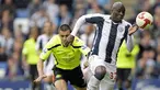 West Bromwich Albion's striker Marc-Antoine Fortune runs away from Wigan's Paul Sharner during English Premier League match between WBA and Wigan at The Hawthorns, on May 9th, 2009. AFP PHOTO/Olly Greenwood