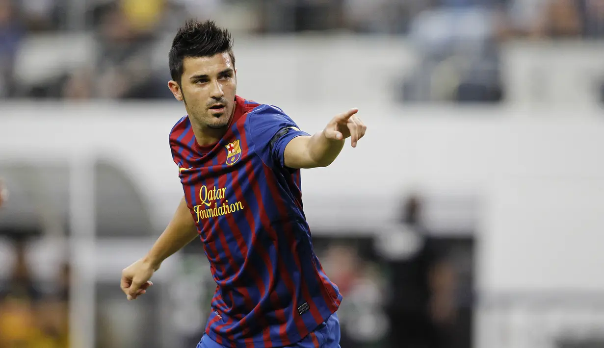 6. David Villa - Jebolan akademi Sporting Gijon ini merupakan salah satu striker yang bergelimang gelar juara. Mulai dari trofi La Liga, Liga Champions hingga Piala Dunia. Mantan pemain Barca itu memutuskan pensiun tahun ini di usia 38 tahun. (AFP/Aaron M. Sprecher)