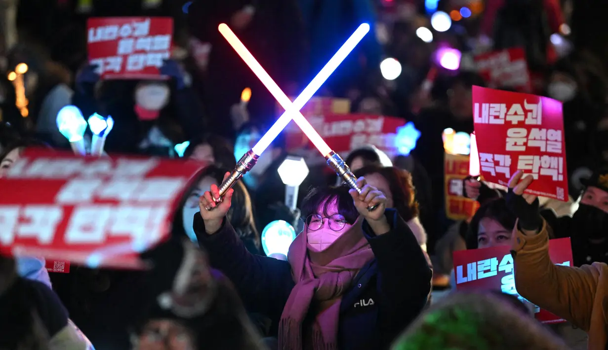 Pada Selasa 10 Desember 2024, pihak berwenang Korea Selatan melarang lebih banyak pejabat tinggi meninggalkan negara tersebut. (Jung Yeon-je/AFP)