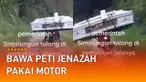 Rekaman video menunjukkan seorang warga membawa peti jenazah menggunakan sepeda motor viral di media sosial.