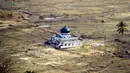 20 tahun sejak tsunami melanda, Aceh dan sekitarnya sudah berbenah dan kembali tertata dengan baik. Psikologi warga telah bangkit. Untuk mengenang memori terhadap bencana itu, dibangunlah Museum Tsunami. (Foto oleh: Chaideer MAHYUDDIN and Adek BERRY/AFP)