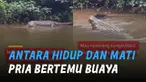 Momen menegangkan dihadapi oleh seorang pria yang bertemu buaya saat sebrangi sungai.