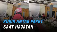 Momen bingung dialami oleh seorang kurir paket mengantarkan paket ke rumah pelanggan yang menggelar hajatan.