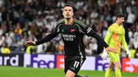 Pada masa tambahan waktu, atau menit ke-90+3, Gabriel Martinelli mencetak gol kemenangan untuk Arsenal. Skor 2-1 bertahan hingga peluit akhir dibunyikan. (JAVIER SORIANO/AFP)