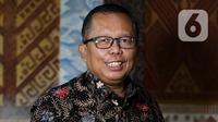 Calon hakim Mahkamah Konstitusi (MK) Arsul Sani berpose usai wawancara khusus dengan Liputan6.com di Jakarta, Kamis (11/1/2024). (Liputan6.com/Herman Zakharia)