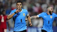Selebrasi striker Timnas Uruguay, Luis Suarez mecetak gol penyeimbang 2-2 ke gawang Timnas Kanada pada laga perebutan tempat ketiga Copa America 2024 di Bank of America Stadium, Charlotte, Amerika Serikat, Minggu (14/7/2024) pagi WIB. (AP Photo/Jacob Kupferman)