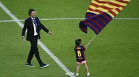 Luis Enrique bersama anaknya, Xana, ketika Barcelona menjadi juara Liga Champions pada 2015. (AFP/Odd Andersen)