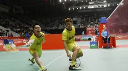 Ganda putra Indonesia Kevin Sanjaya/Marcus Gideon saat melawan wakil Thailand, Tinn Isriyanet/Kittisak Namdash, pada laga Indonesia Masters 2018 di Istora Senayan, Rabu (24/1/2018). Kevin/Marcus menang 21-16 21-16. (Bola.com/M Iqbal Ichsan)