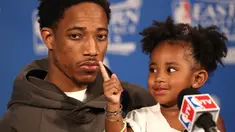 Pebasket Raptors, DeMar DeRozan #10 dicolok hidungnya oleh sang putri tercinta, Diar DeRozan saat memberikan keterangan pers usai  Final Wilayah Barat  NBA Playoffs 2016 di Air Canada Centre, (23//5/2016). Tom Szczerbowski/Getty Images/AFP