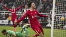 Pemain Liverpool, Curtis Jones merayakan gol penyeimbang 1-1 ke gawang Newcastle pada laga lanjutan Liga Inggris 2024/2025 di St James Park Stadium, Newcastle, Inggris, Kamis (05/12/2024) WIB. (AP Photo/Ian Hodgson)