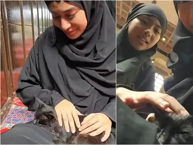 Dalam unggahan foto yang beredar, Dian terlihat anggun mengenakan jilbab hitam dan tersenyum lembut sambil mengelus bulu kucing itu. Cahaya matahari yang masuk ke dalam masjid semakin mempertegas suasana damai yang terpancar dari wajahnya. Momen ini pun menarik perhatian warganet yang memuji kelembutan hati sang aktris. (Liputan6.com/IG/@therealdisastr)