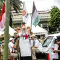 Peserta kader Partai Keadilan Sejahtera (PKS) puisi saat melakukan aksi bela Palestina di depan Kedutaan Besar Amerika Serikat, Jakarta, Kamis (20/5/2021). Aksi tersebut dalam rangka berempati kepada bangsa Palestina untuk mendapatkan kemerdekaannya dari serangan Israel. (Liputan6.com/Faizal Fanani)