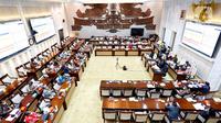 Suasana rapat kerja antara Menteri Keuangan Sri Mulyani Indrawati bersama Wakil Menteri Keuangan Suahasil Nazara dengan Komisi XI DPR di Jakarta, Rabu (19/1/2022). Rapat terkait evaluasi APBN tahun 2021 dan Pemulihan Ekonomi Nasional (PEN) 2021 serta rencana PEN 2022. (Liputan6.com/Angga Yuniar)