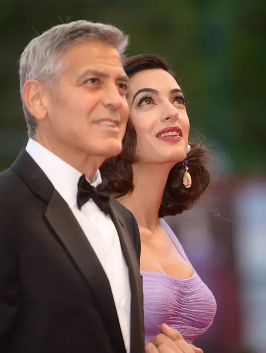 Satu hari sebelum screening film tersebut, George dikabarkan berkumpul dengan teman-temannya untuk makan malam bersama yang masih dalam rangkaian acara tersebut. (AFP/Filippo Monteforte