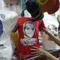 Pembuatan kaos tersebut mulai banyak diproduksi setelah penetapan capres dan cawapres yang diusulkan oleh Partai Politik atau Gabungan. (Liputan6.com/Faizal Fanani)