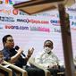 Menteri Badan Usaha Milik Negara (BUMN) Erick Thohir dalam seminar Asosiasi Media Siber Indonesia (AMSI) bertajuk "Menuju Masyarakat Cashless" di Auditorium Perpustakaan Nasional, Jakarta, Rabu (3/8/2022).