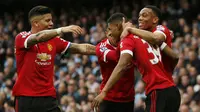 Striker Manchester United, Marcus Rashford melakukan selebrasi usai menjebol gawang Manchester City, pada laga lanjutan Premier League 2015-2016, di Etihad Stadium, Minggu (20/3/2016) malam WIB. Rashford berstatus pencetak gol termuda pada Manchester Derb