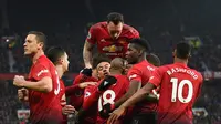 Pemain Manchester United (MU) merayakan gol Paul Pogba pada laga melawan Brighton & Hove Albion di Old Trafford, Sabtu (19/1/2019). (AFP/Oli Scarff)