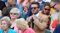 Mantan pesepak bola Inggris, David Beckham menyaksikan babak semifinal Grand Slam Wimbledon di All England Lawn Tennis Club, Kamis (11/7/2019). Beckham menjadi saksi petenis Rumania Simona Halep lolos ke final usai menang atas Elina Svitolina dari Ukraina 6-1, 6-3. (Mike Egerton/Pool Photo via AP)