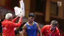 Ekspersi Pegulat putra Indonesia, Muhammad Aliansyah usai bertarung dengan Zhang Gaoquan dari China pada kelas putra 67 Kg di arena gulat JCC Senayan, Selasa (21/8). Aliansyah kalah atas lawanya dengan skor 0-7. (Liputan6.com/Fery Pradolo)