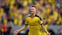 Marco Reus melakukan selebrasi usai jebol gawang Gladbach
