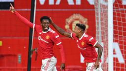 Anthony Elanga. Sayap Manchester United berusia 19 tahun ini berhasil membuat 2 gol dalam laga pra-musim lalu. Kecerdikan mencari posisi merupakan kelebihannya yang dapat dimaksimalkan pelatih Ole Gunnar Solskjaer pada musim ini.(Foto: AFP/Paul Ellis)