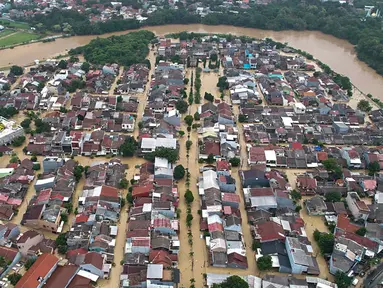 Foto selebaran yang diambil dan dirilis pada Selasa 4 Maret 2025 oleh Badan Nasional Penanggulangan Bencana (BNPB) ini menunjukkan gedung-gedung yang terendam banjir di Bekasi, Jawa Barat. (Foto oleh Handout/Badan Nasional Penanggulangan Bencana/AFP)