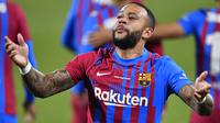 Memphis Depay menjadi salah satu aktor kemenangan Barcelona pada pertandingan Joan Gamper Thropy yang berlangsung di Estadio Johan Cruyff, Senin (9/8/2021). Skuat Barca mampu tekuk Juventus dengan skor 3-0. (Foto: AFP/Pau Barrena)