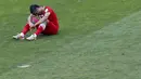 Pemain belakang Iran, Amir-Hossein Sadeghi, terduduk usai dikalahkan Agentina 0-1 di babak penyisihan Piala Dunia Grup F di Stadion Mineirao, Belo Horizonte, Brasil (21/6/2014). (REUTERS/Leonhard Foeger)