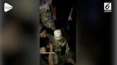 Seorang anak kecil ditemukan dalam genangan lumpur akibat suara tangisannya.